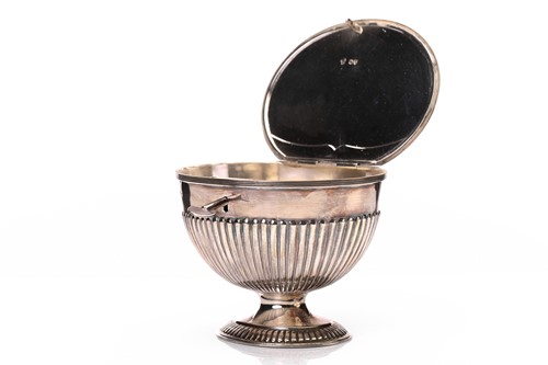 Lot 595 - A Victorian silver oval tea caddy, the hinged...