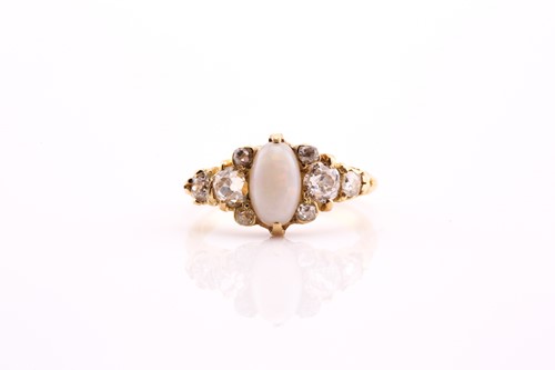 Lot 329 - An opal and diamond ring, the oval pale opal...