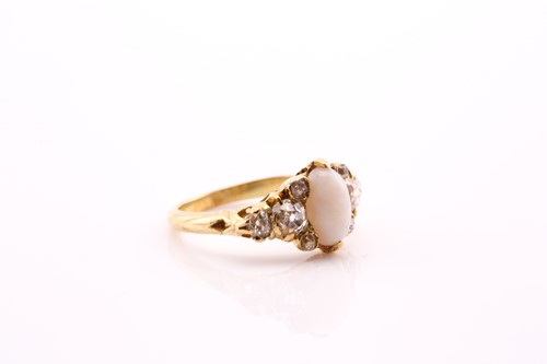 Lot 329 - An opal and diamond ring, the oval pale opal...