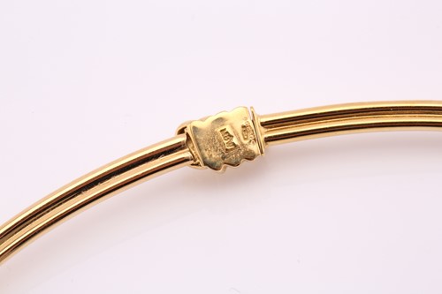 Lot 30 - A Mappin and Webb 18ct yellow gold articulated...