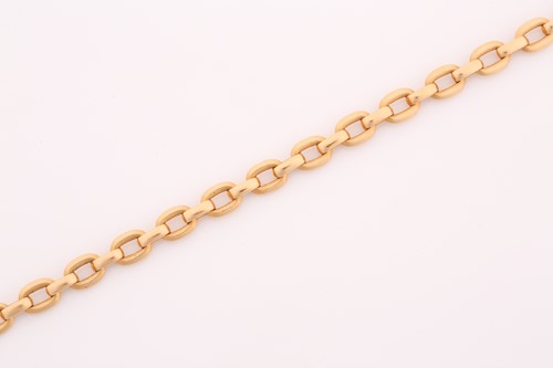 Lot 242 - A Cartier flat oval link bracelet measuring 20....