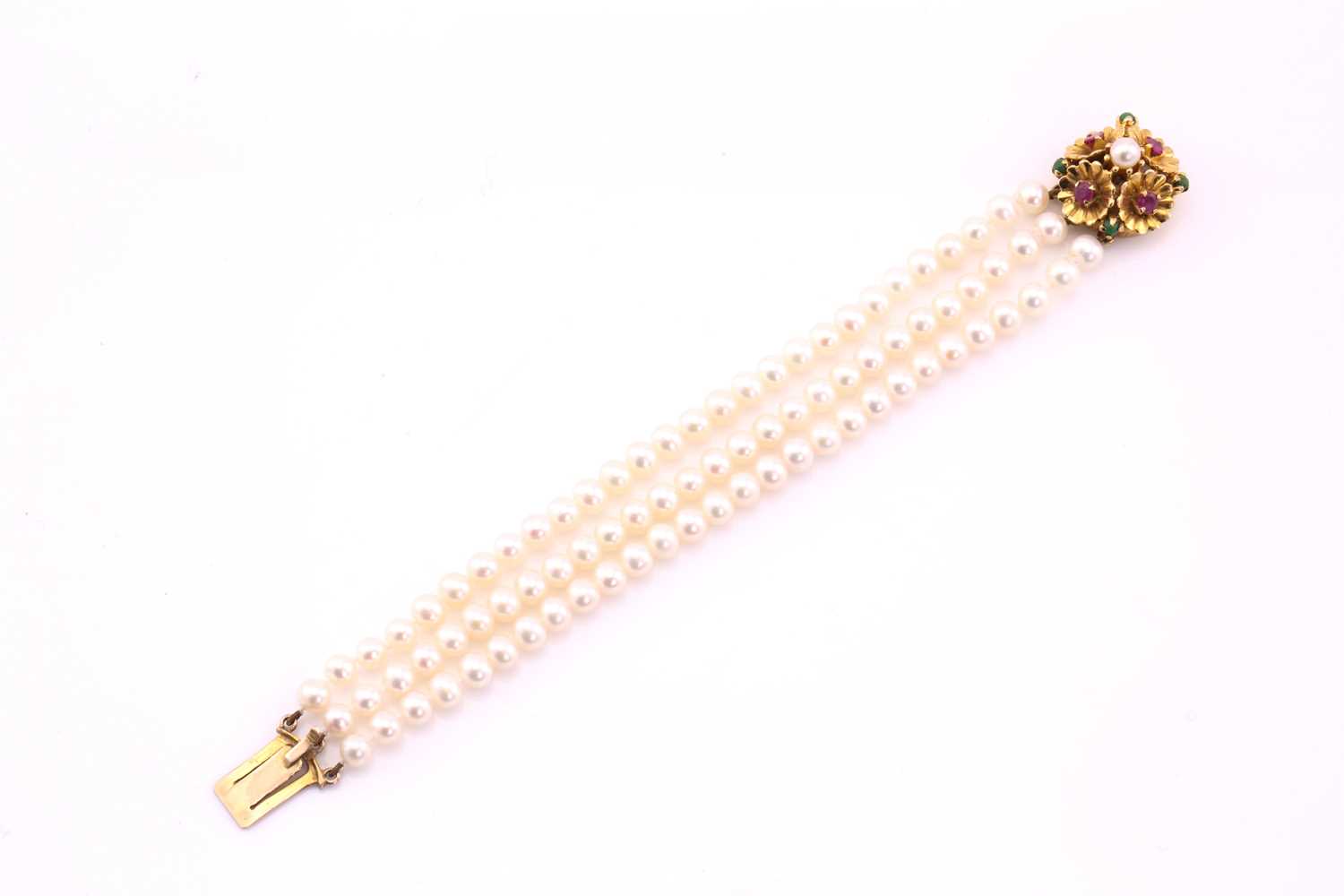 Lot 55 - A cultured pearl and gem-set bracelet; the...