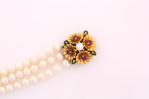 Lot 55 - A cultured pearl and gem-set bracelet; the...