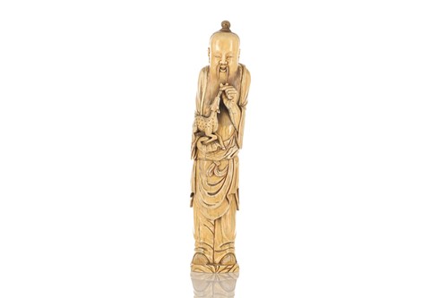 Lot 184 - A Chinese ivory figure of Shoulao feeding a...