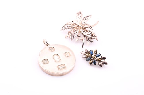 Lot 306 - Two brooches and a pendant, the flowerhead...