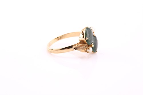 Lot 80 - A jade and pearl ring, claw set with two oval...