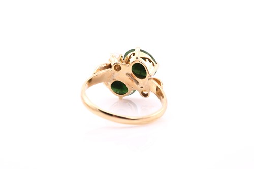 Lot 80 - A jade and pearl ring, claw set with two oval...