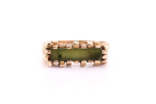 Lot 260 - A 9ct yellow gold jade ring, with a bark...