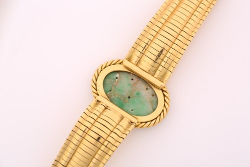Lot 340 - A Jade bracelet, the central oval carved jade...
