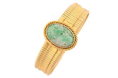 Lot 340 - A Jade bracelet, the central oval carved jade...