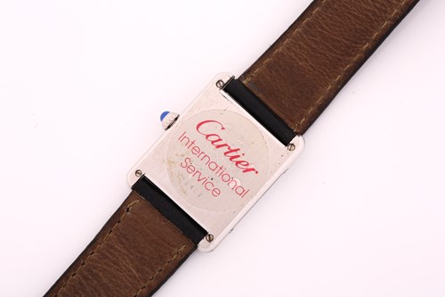 Lot 543 - A silver Cartier Tank ladies wristwatch with a...