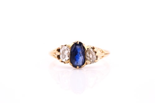 Lot 453 - A sapphire and diamond three stone ring, the...