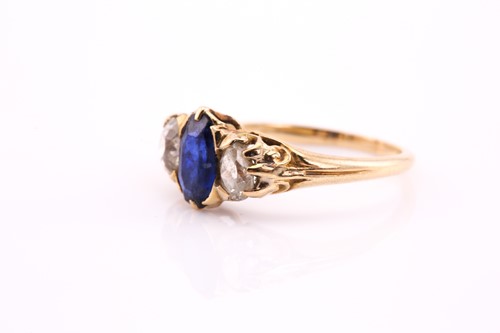 Lot 453 - A sapphire and diamond three stone ring, the...