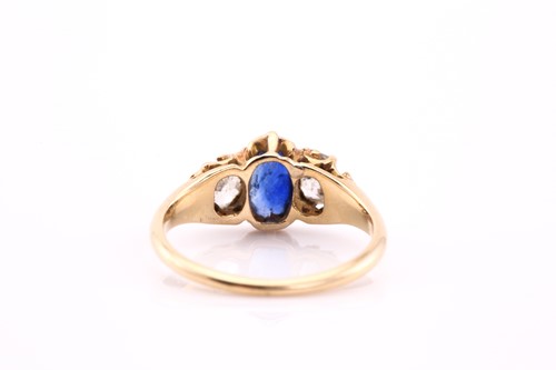Lot 453 - A sapphire and diamond three stone ring, the...
