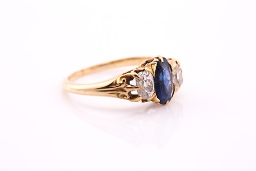Lot 453 - A sapphire and diamond three stone ring, the...