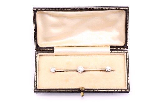 Lot 220 - A three-stone old cut diamond set bar brooch,...