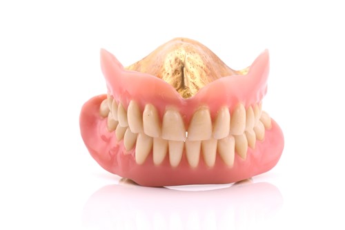 Lot 44 - Pair of false teeth with gold content, 53.8...
