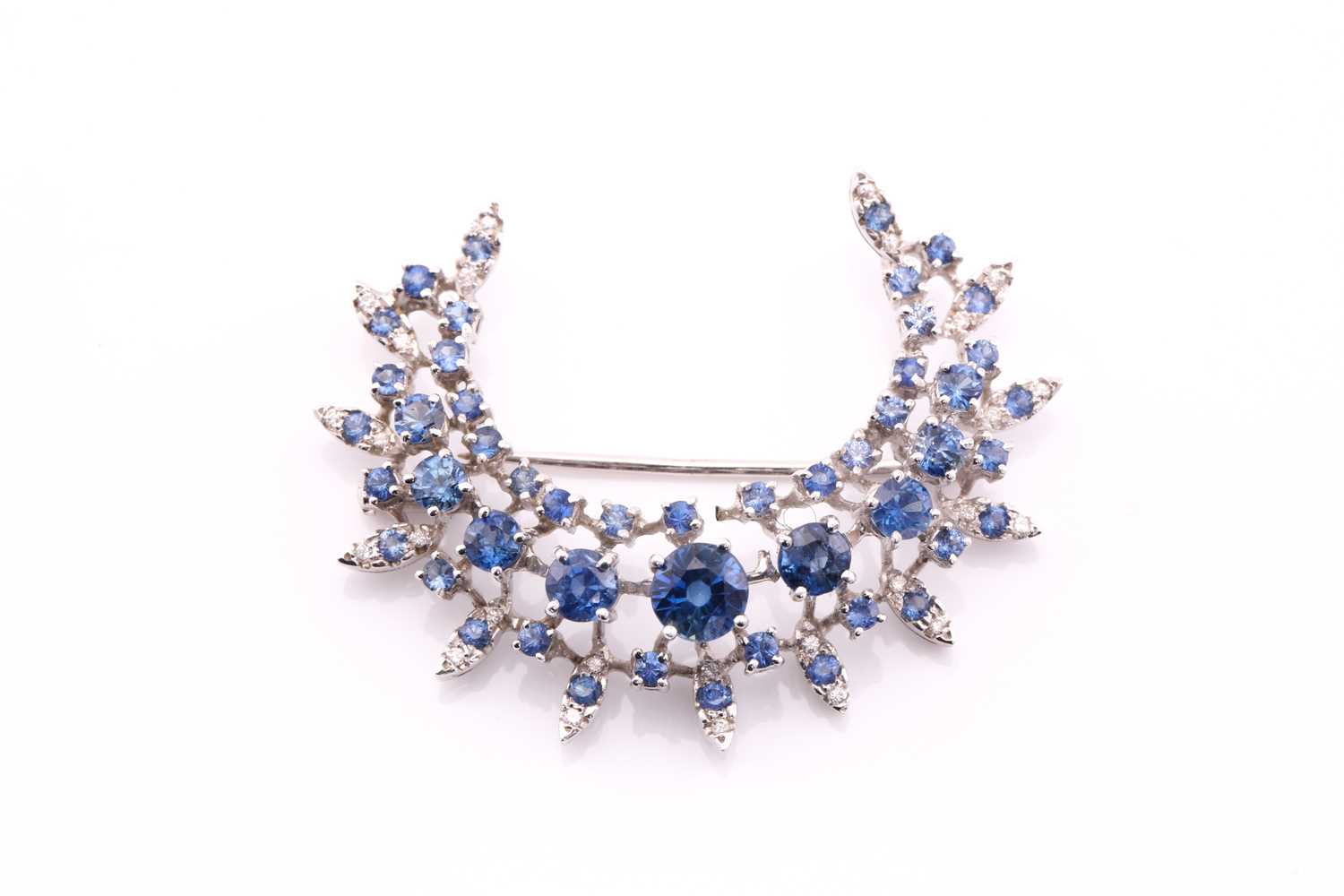 Lot 413 - A sapphire and diamond crescent shape brooch,...