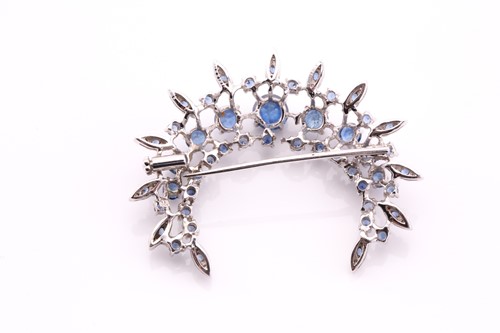 Lot 413 - A sapphire and diamond crescent shape brooch,...