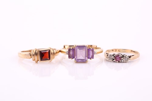 Lot 403 - Three rings, comprising of a ruby and diamond...