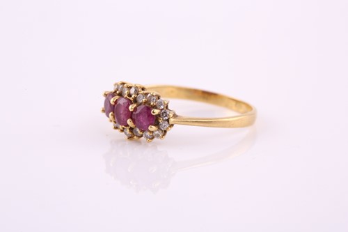Lot 18 - A ruby and diamond ring; the three oval and...
