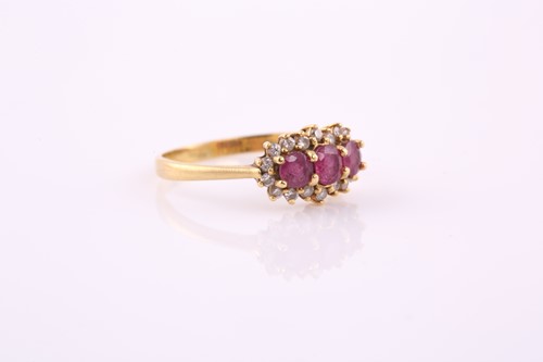 Lot 18 - A ruby and diamond ring; the three oval and...
