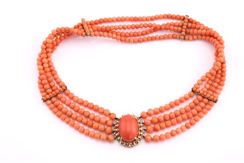 Lot 301 - A four row coral bead necklace, with four...