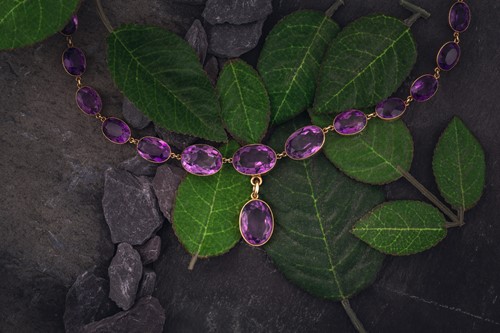 Lot 150 - An amethyst riviere necklace, early 20th...