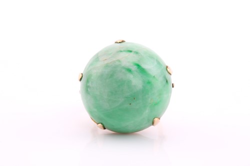 Lot 452 - A large jade cabochon dress ring, modern, claw...