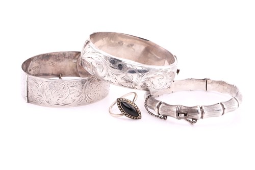 Lot 224 - Three silver hinged bangles and a white metal...