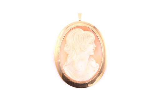 Lot 165 - An Italian shell cameo brooch, the oval panel...