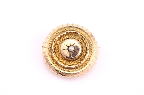 Lot 390 - A late Victorian disc shape brooch, centred by...