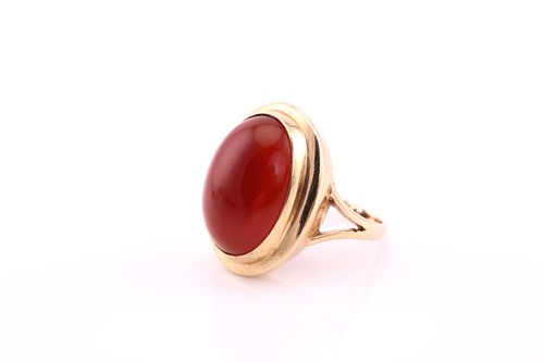 Lot 53 - A carnelian cabochon ring, mid 20th century,...