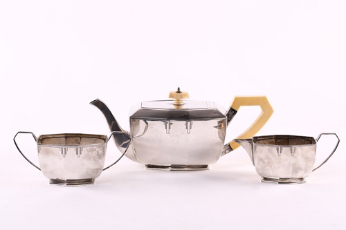 Lot 564 - A 1930s Art Deco silver three-piece tea set,...
