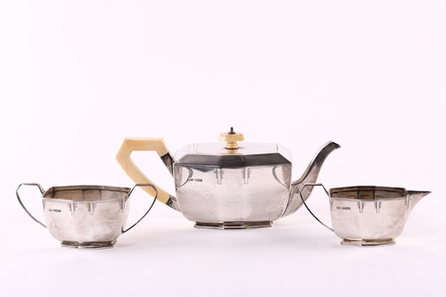 Lot 564 - A 1930s Art Deco silver three-piece tea set,...