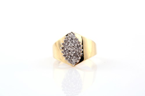 Lot 303 - A diamond dress ring; the central marquise...