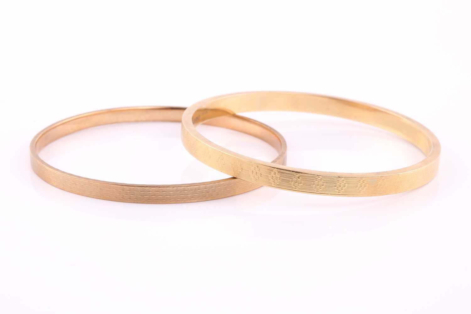 Lot 451 - Two gold bangles comprising of a 15ct hollow...