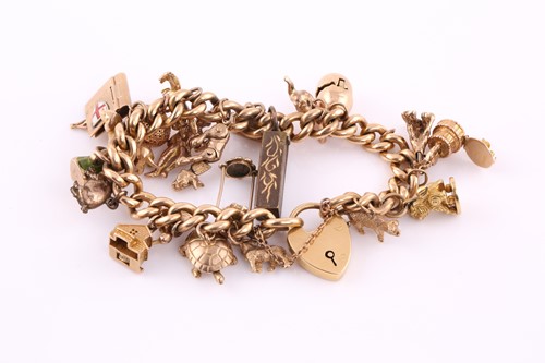 Lot 352 - An gold charm bracelet; the 18 carat curb...