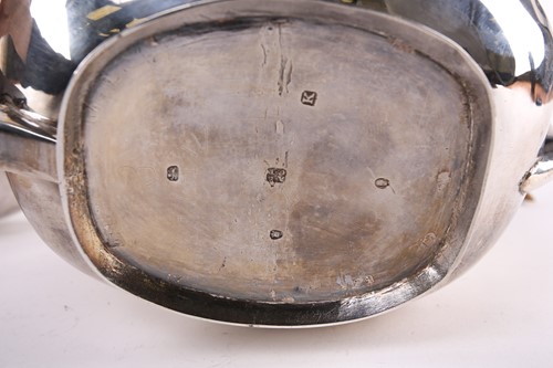 Lot 589 - A George III silver teapot of pot-bellied...