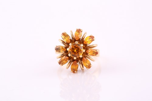 Lot 135 - A citrine set cluster ring, consisting of a...