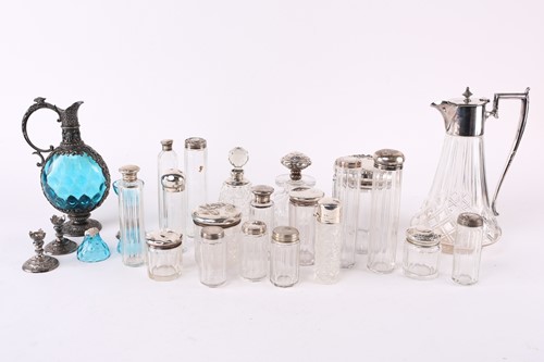 Lot 556 - Collection of silver topped scent bottles and...