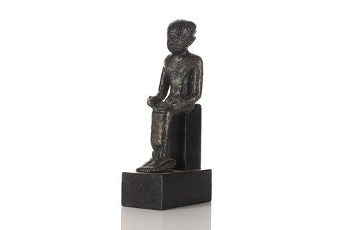 Lot 461 - An Egyptian seated bronze figure of the scribe...