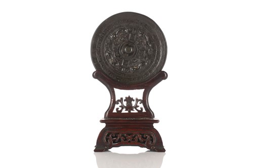 Lot 175 - A Chinese bronze mirror, possibly Han dynasty,...