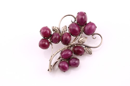 Lot 207 - A ruby spray brooch set with eleven oval...