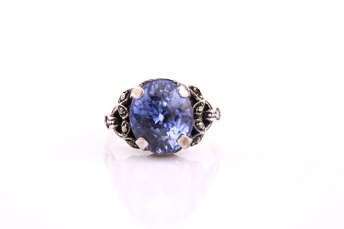 Lot 102 - An oval sapphire single stone dress ring,...