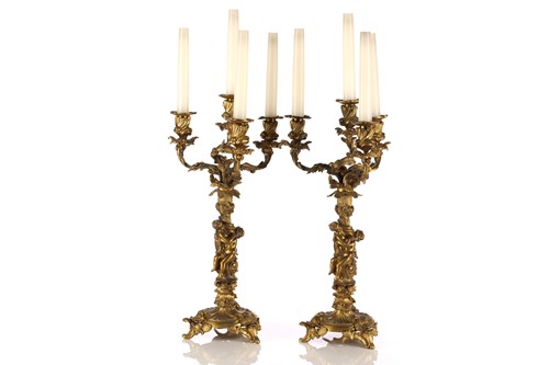 Lot 333 - A pair of gilt bronze four sconce figural...