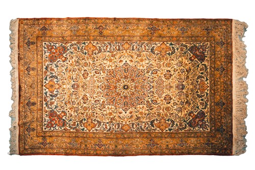 Lot 328 - An Eastern silk on silk carpet with ivory...