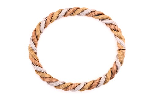 Lot 158 - A 9ct tri-coloured gold twisted bangle, with...