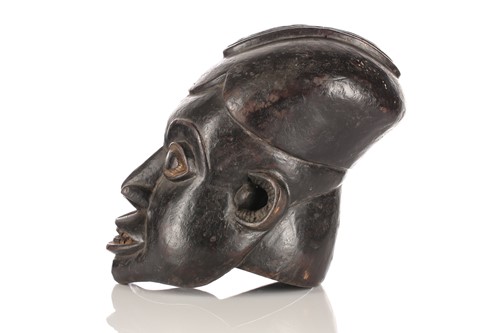 Lot 91 - A Bamun helmet mask, Cameroon, an elliptical...