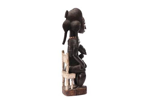 Lot 59 - A Baule maternity figure, Ivory Coast, the...